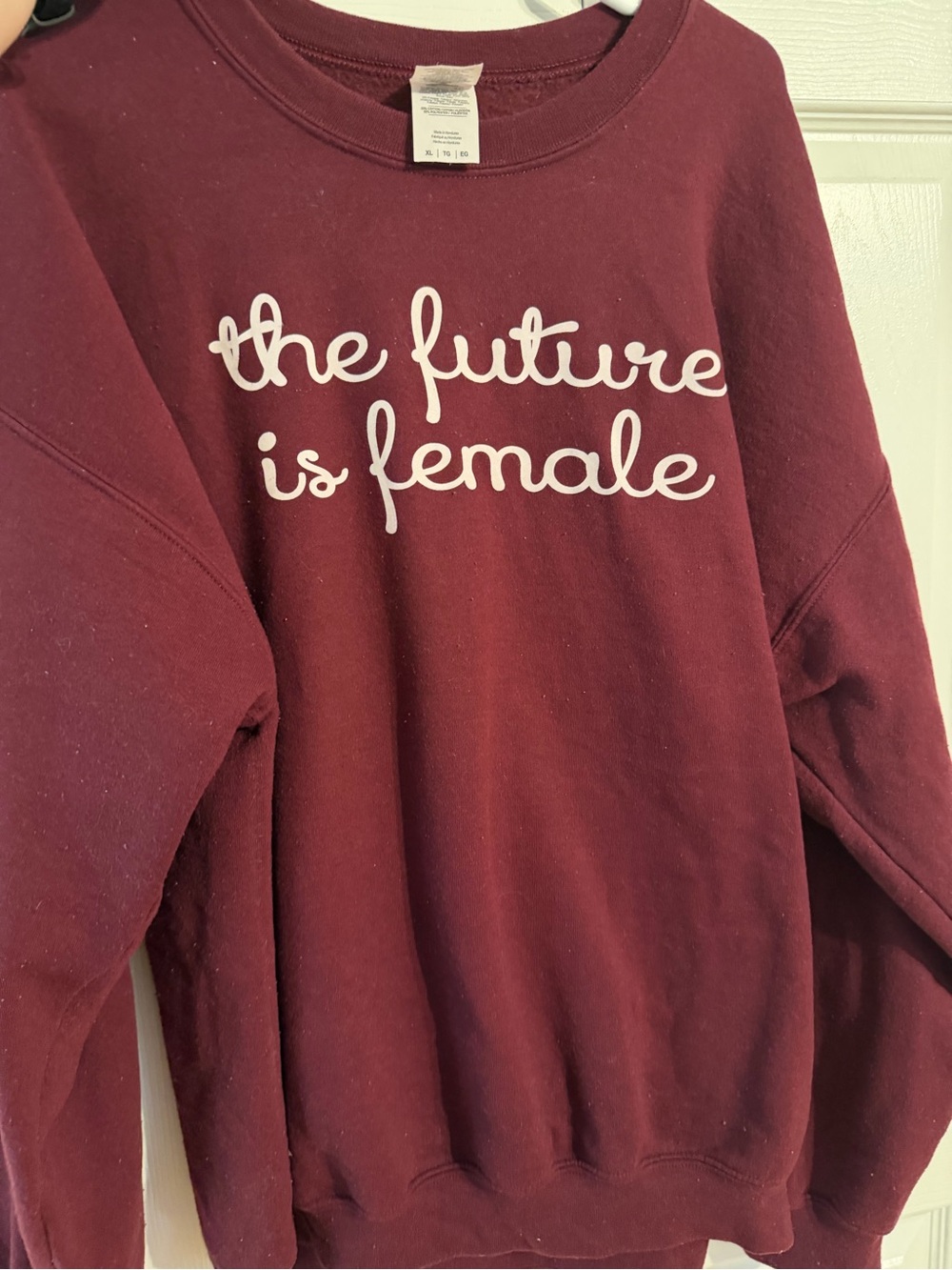 Maroon Sweatshirt "the future is female". Pilling on sweater